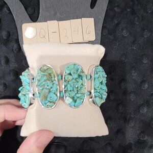 Item #Q246  Sterling Silver 1.5 in glued turquoise bead pieces-stretchy Bracelet
